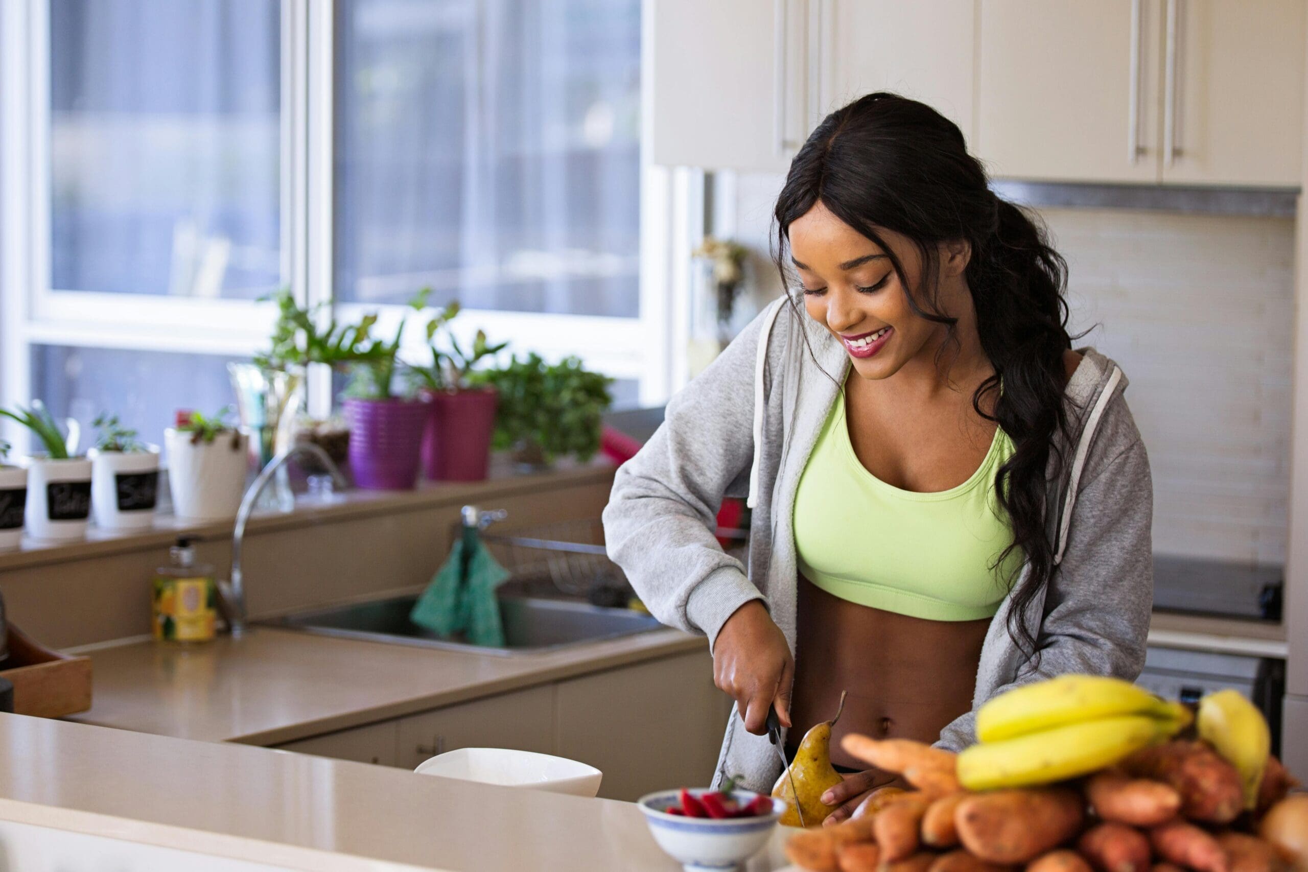 pexels-mastercowley-1153369 Woman makes healthy meal