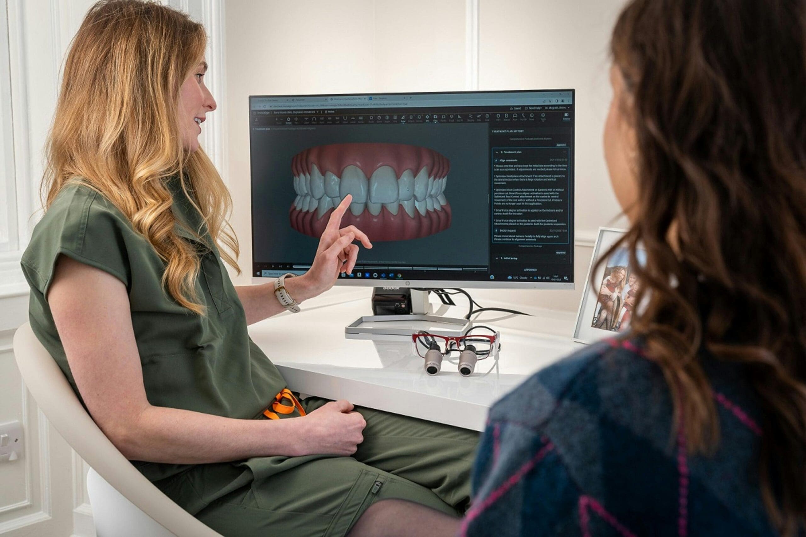 Dentist consulting with patient